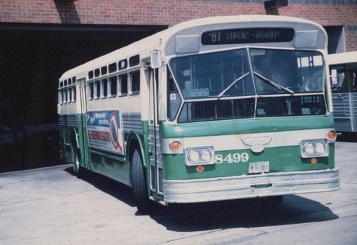 A green, silver, and cream Chicago Transit Authority bus, number 8499, is parked on a street with a 'Lawrence-Broadway' route sign and a fingerprint registry advertisement on its side.