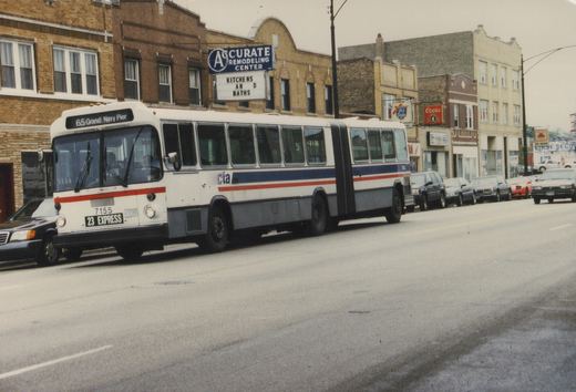 A white, blue, and red articulated CTA bus, number 7155, is driving down a city street lined with parked cars and brick buildings under an overcast sky.