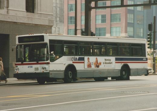 A white Chicago Transit Authority bus, numbered 4198, is shown on a city street with a destination sign reading '156 to UNION STA' and an advertisement for United Airlines on its side.