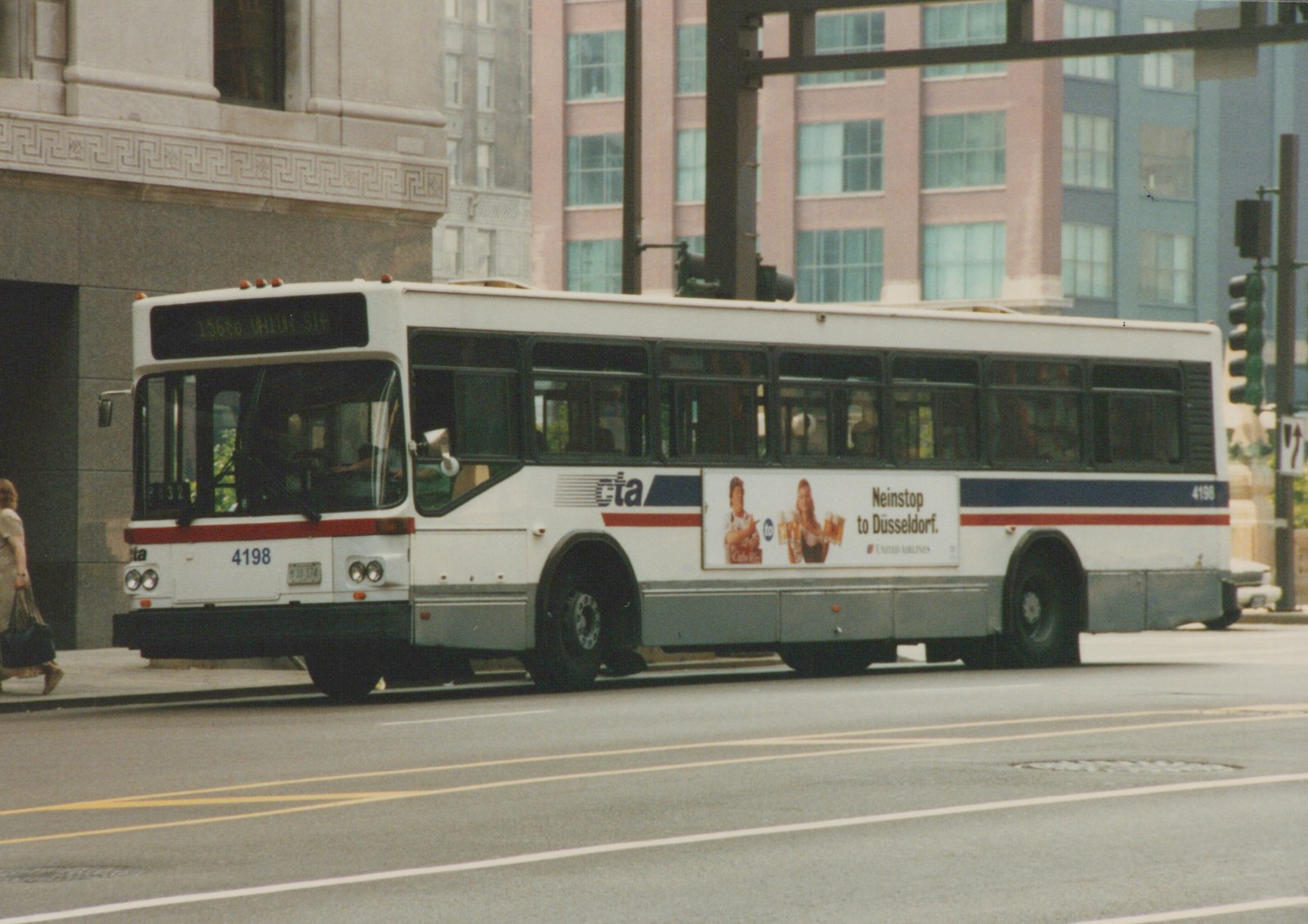 A white Chicago Transit Authority bus, numbered 4198, is shown on a city street with a destination sign reading '156 to UNION STA' and an advertisement for United Airlines on its side.