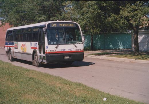 A white Chicago Transit Authority bus with red and blue stripes, numbered 4637, is driving down a suburban street under a clear sky.