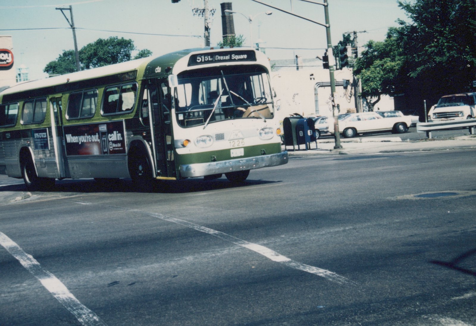 A green and cream Chicago Transit Authority bus, number 1226, turning on a city street with a destination sign reading '5151 | Drexel Square'.