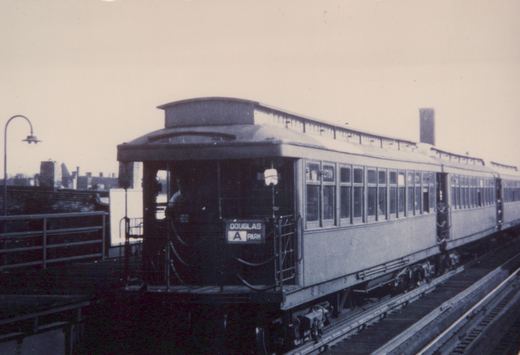 A vintage black and white photo of a Chicago Rapid Transit Company rapid transit car, number 2719, on an elevated track with a destination sign reading 'DOUGLAS A PARK'.