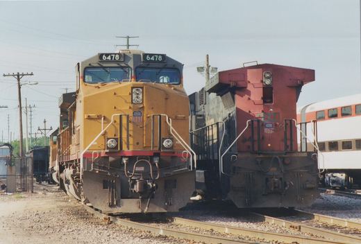 A front view of two Union Pacific diesel locomotives, numbers 6478 and 6268, parked next to each other in a rail yard on a clear day.