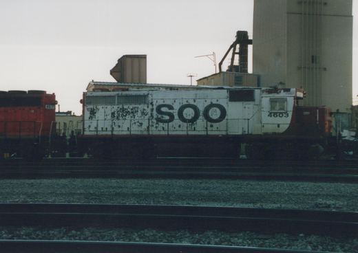 Two SOO Line diesel locomotives, numbers 4603 and 4617, side-by-side on tracks in a yard under an overcast sky.