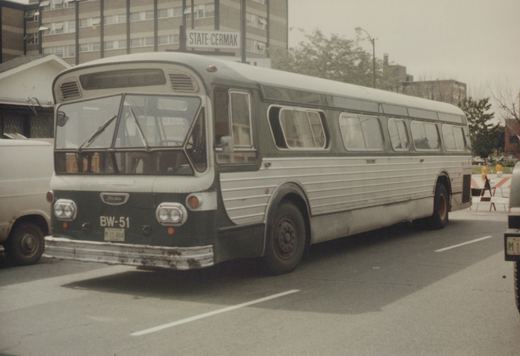 A green and white CTA bus, model Flxible New Look, number BW-51, is parked on a street with a 'STATE-CERMAK' street sign visible in the background.