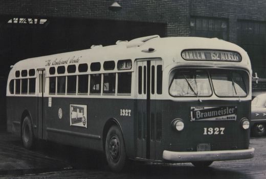 A black and white photo of a vintage Chicago Surface Lines motor bus, number 1327, parked on a city street with a destination sign reading 'Harlem 152 Addison' and an advertisement for Braumeister Beer on the front.