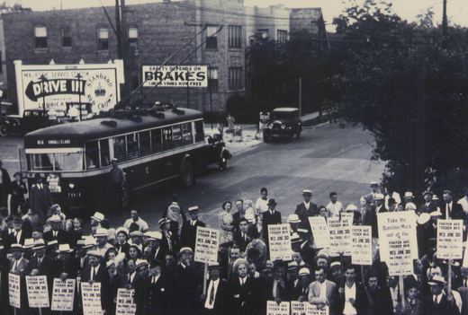 A black and white photo shows a trolleybus on a city street with a large crowd of people holding protest signs, one of which reads 'FOSTER AVE FEEDER BUS WED. JUNE 30', marking the last day of trolleybus service on that route.
