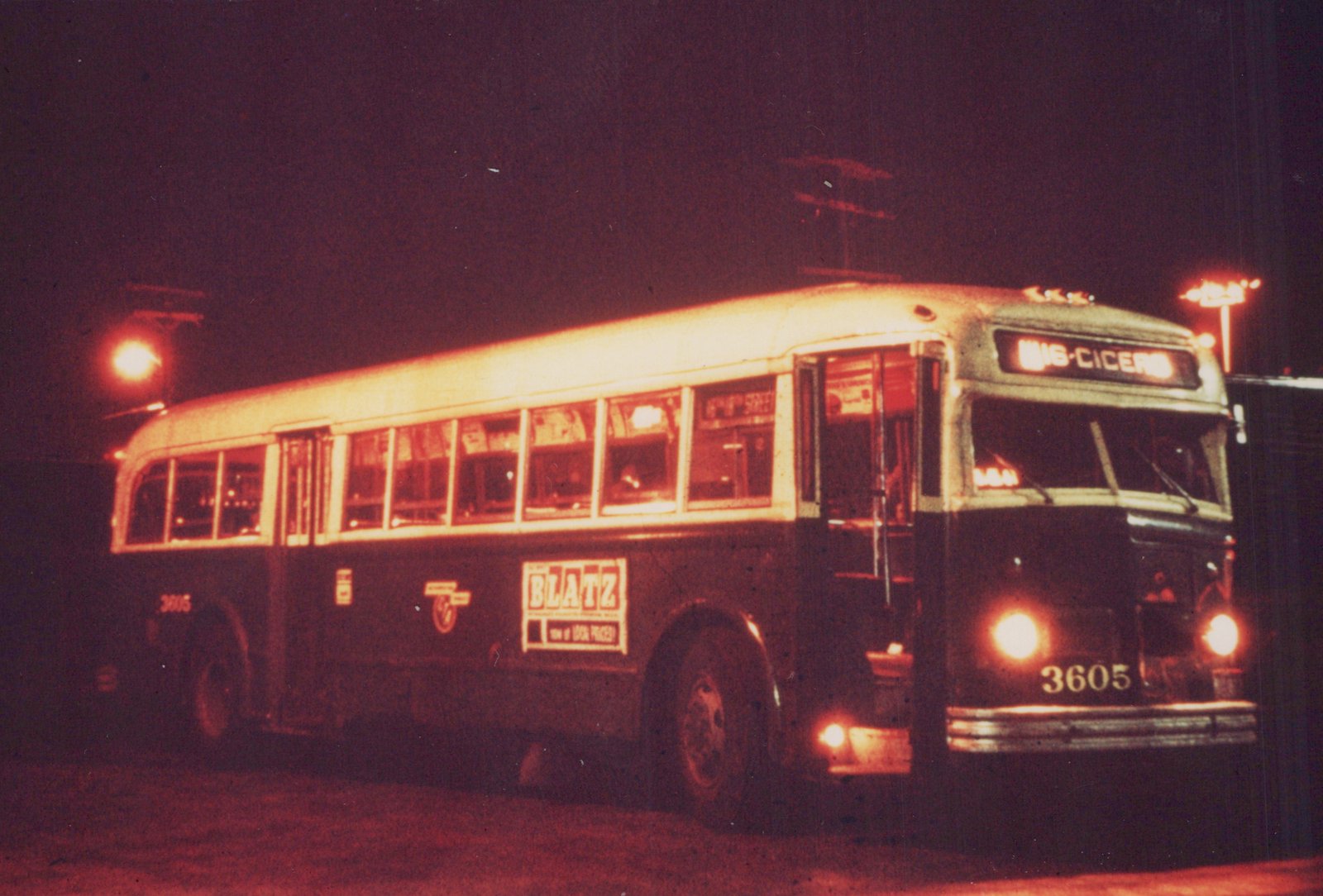 A vintage city bus at night, with its destination sign reading 16-Cicero and fleet number 3605 visible on the side and front.