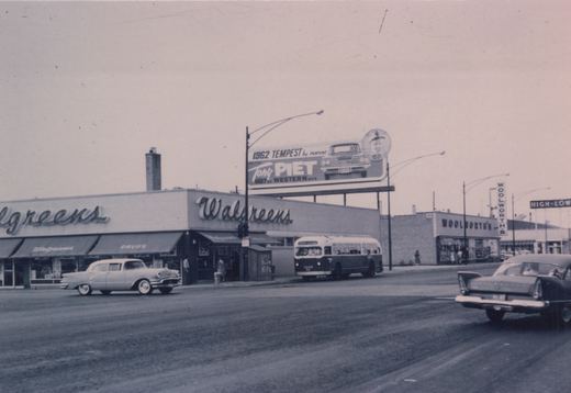 A black and white photograph shows a Chicago Transit Authority bus at a busy street corner with Walgreens and Woolworth's stores, and a billboard advertising a 1962 Pontiac Tempest.