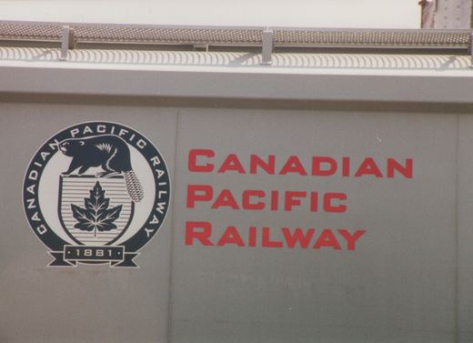 A close-up photo of a gray Canadian Pacific Railway freight car, with red lettering and the company's crest featuring a beaver and maple leaf.