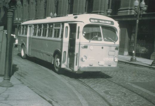 A vintage black-and-white photo of a Chicago Transit Authority bus with fleet number 2503, showing its front and side on a paved street with embedded track.