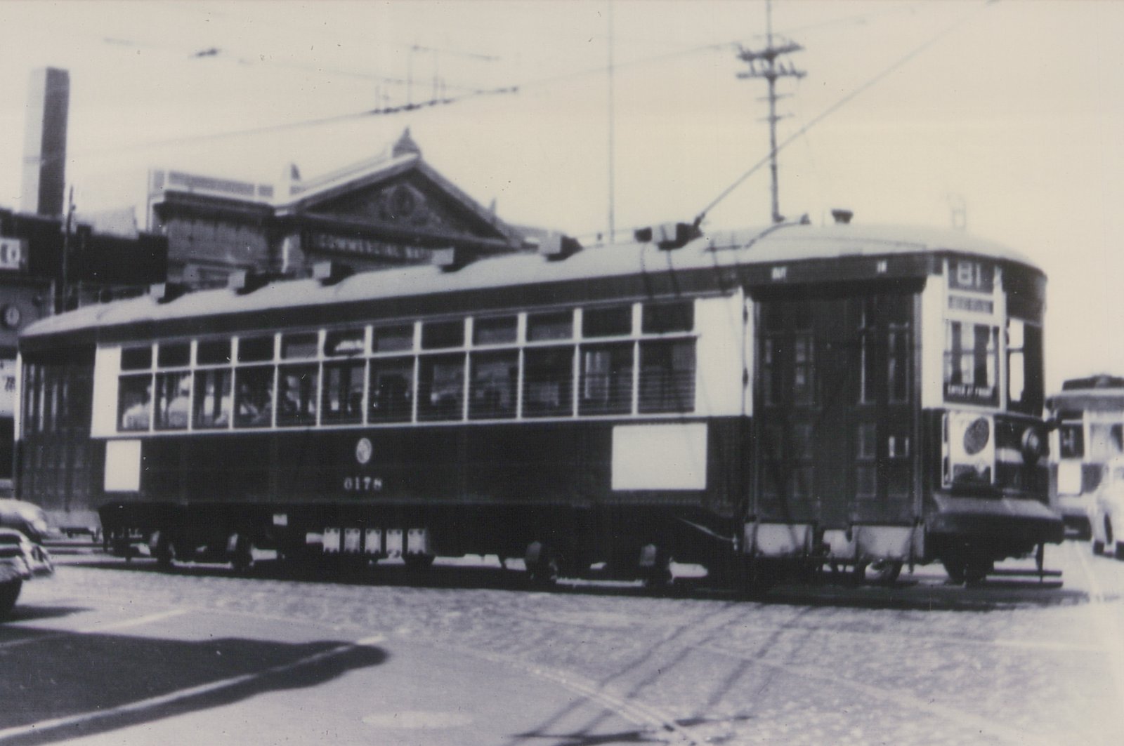 A vintage black-and-white photo of a Chicago Surface Lines streetcar, number 6178, on a city street with a building labeled 'Commercial Wharf' behind it.