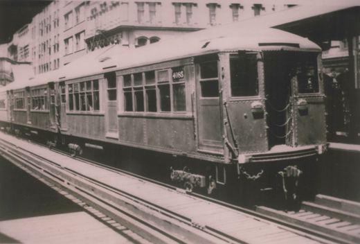 A black-and-white photo of a Chicago Rapid Transit Company 4000-series rapid transit car, numbered 4085, at an elevated station with a platform and tracks visible.